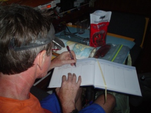 Don writing in the guest book.
